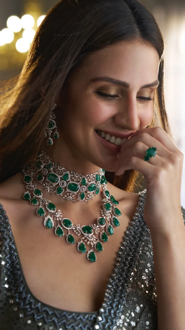 A bride of the modern era, in a pairing of an exquisite choker of pan-and-cushion-cut emeralds, layered with a necklace of oval-and-pan-cut emeralds, creating a symphony in green.

Outfit: @sawangandhiofficial 

#TheHouseofRose #RoseJewellery #LuxuryJewellery #DesignerJewellery #RoseBridal #NaturalDiamonds #Emeralds #Gemstones #HighJewellery #hautejoaillerie #MyTrousseauMyTreasure